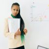 Confident analyst presenting financial data and growth charts in a modern office setting.